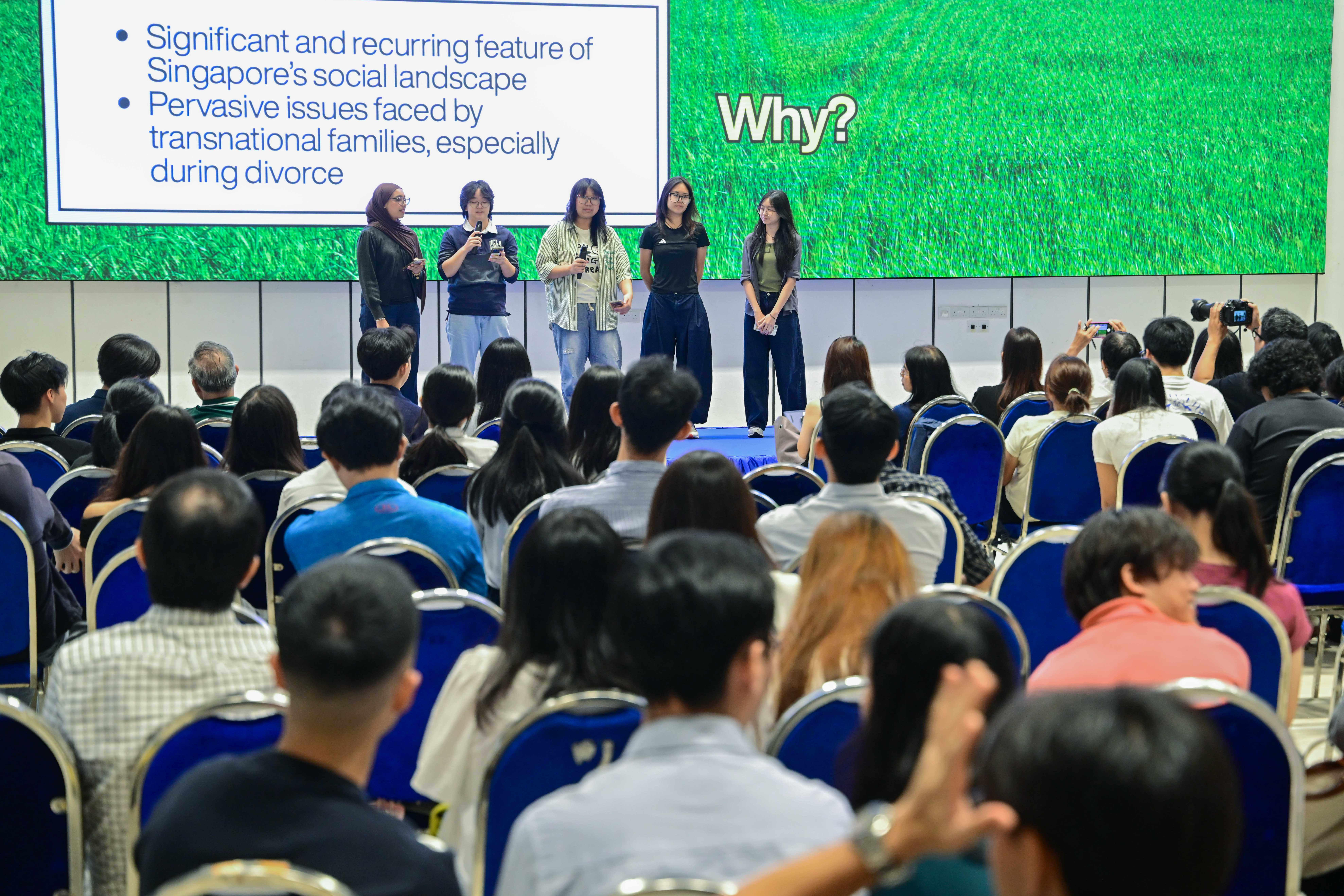Five students explaining their problem statement to the audience